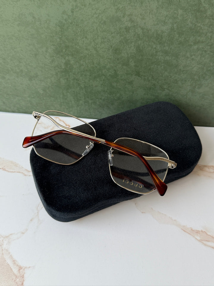 Gucci GG0973O Marcos de metal plateado