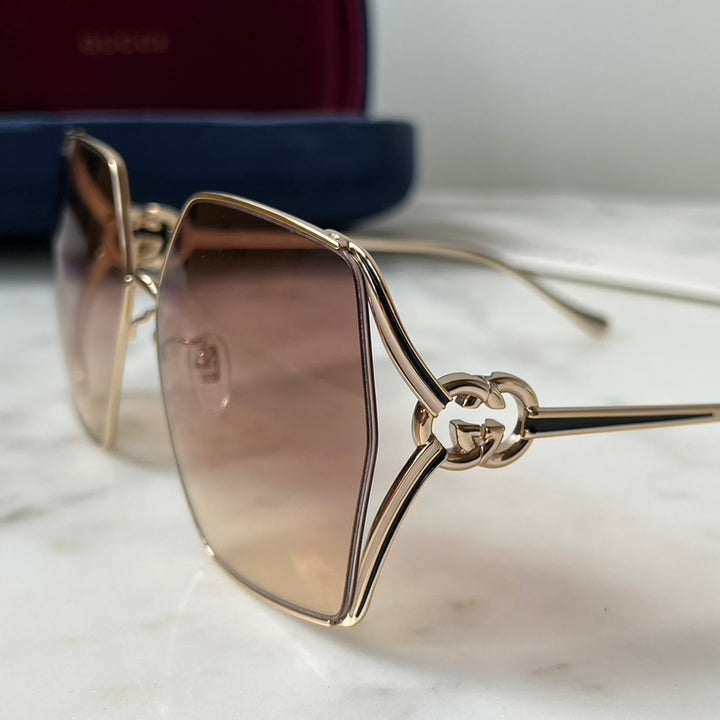 Gafas de sol de metal Gucci GG1322SA con lentes rosas