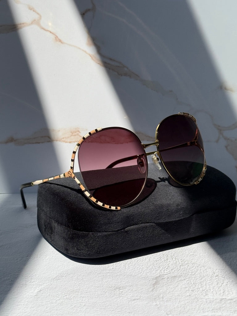 Gucci GG0595S Oversized Cutout Round Sunglasses in Brown Gradient