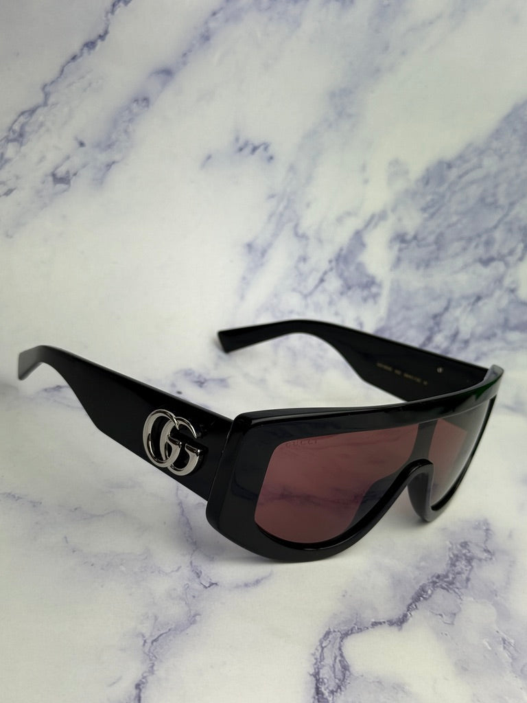 Gucci GG1257S Gafas de sol redondeadas con lentes marrones y rojos