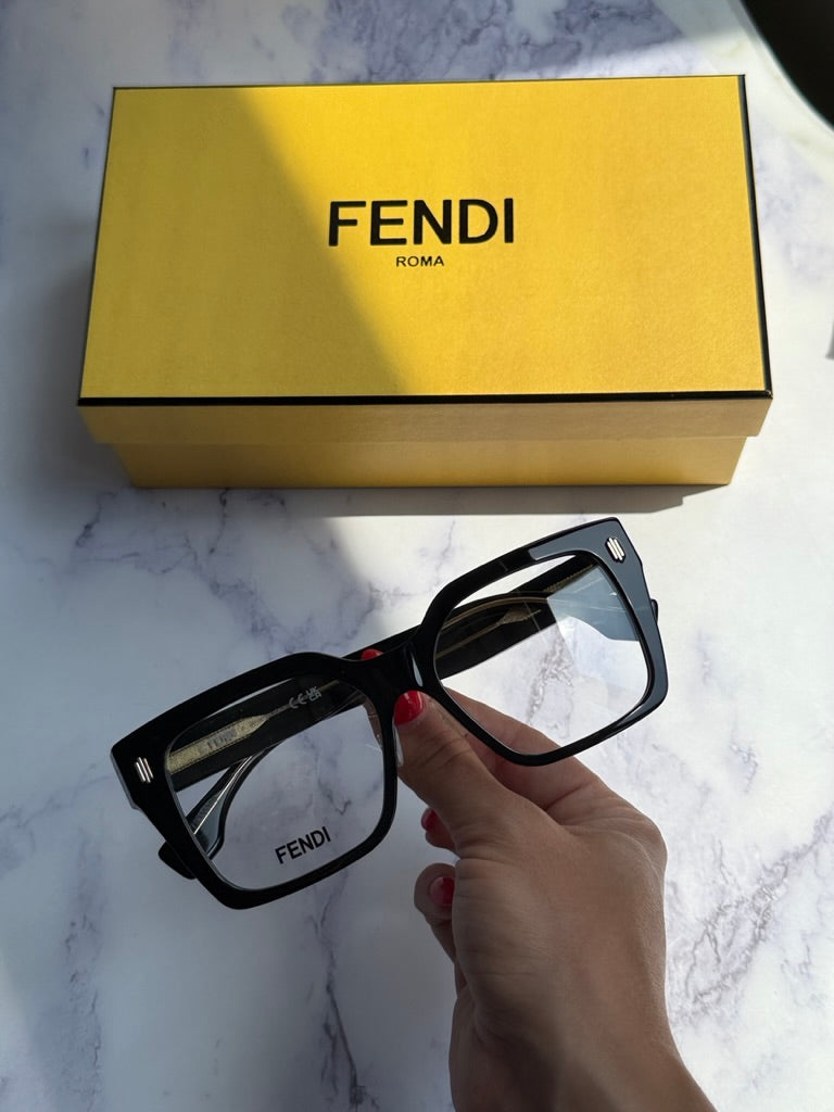 Fendi black square eyeglass frames held with clear lenses visible
