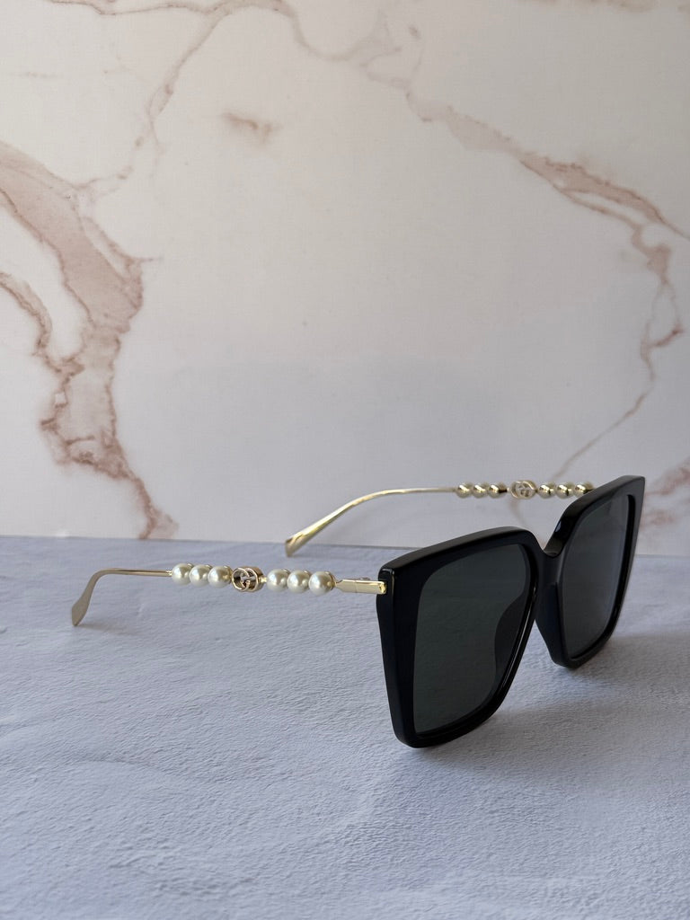Gucci GG1257S Gafas de sol redondeadas con lentes marrones y rojos