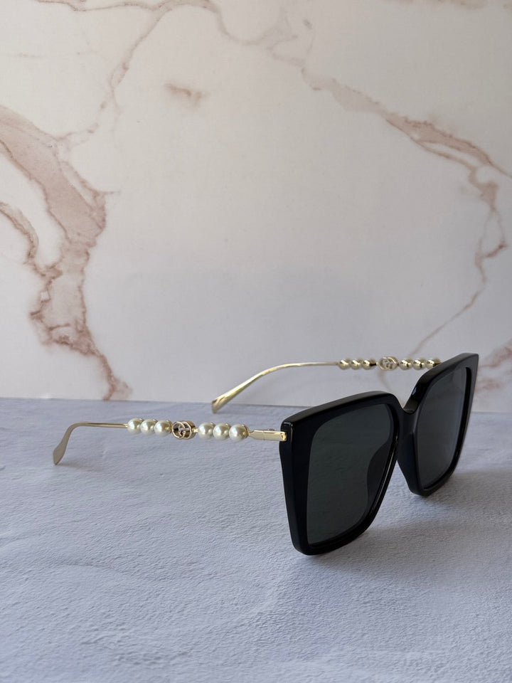 Gucci GG1257S Gafas de sol redondeadas con lentes marrones y rojos