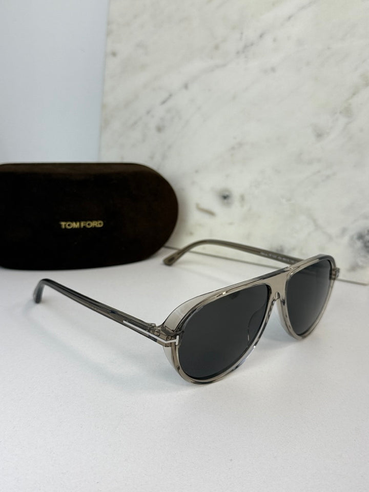 Aviator sunglasses with dark lenses and silver frame, angled side view with case