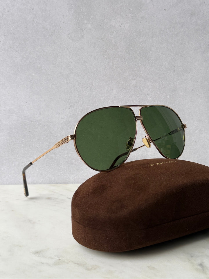 Rose gold aviator sunglasses with green tinted lenses and gold bridge