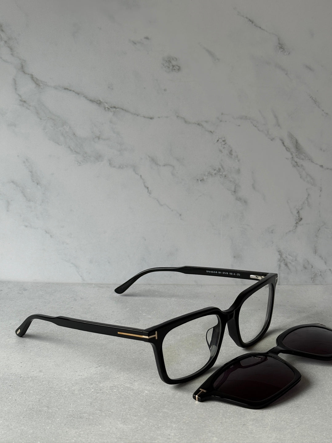 Black rectangular sunglasses set with clear frame and dark clip-on lens