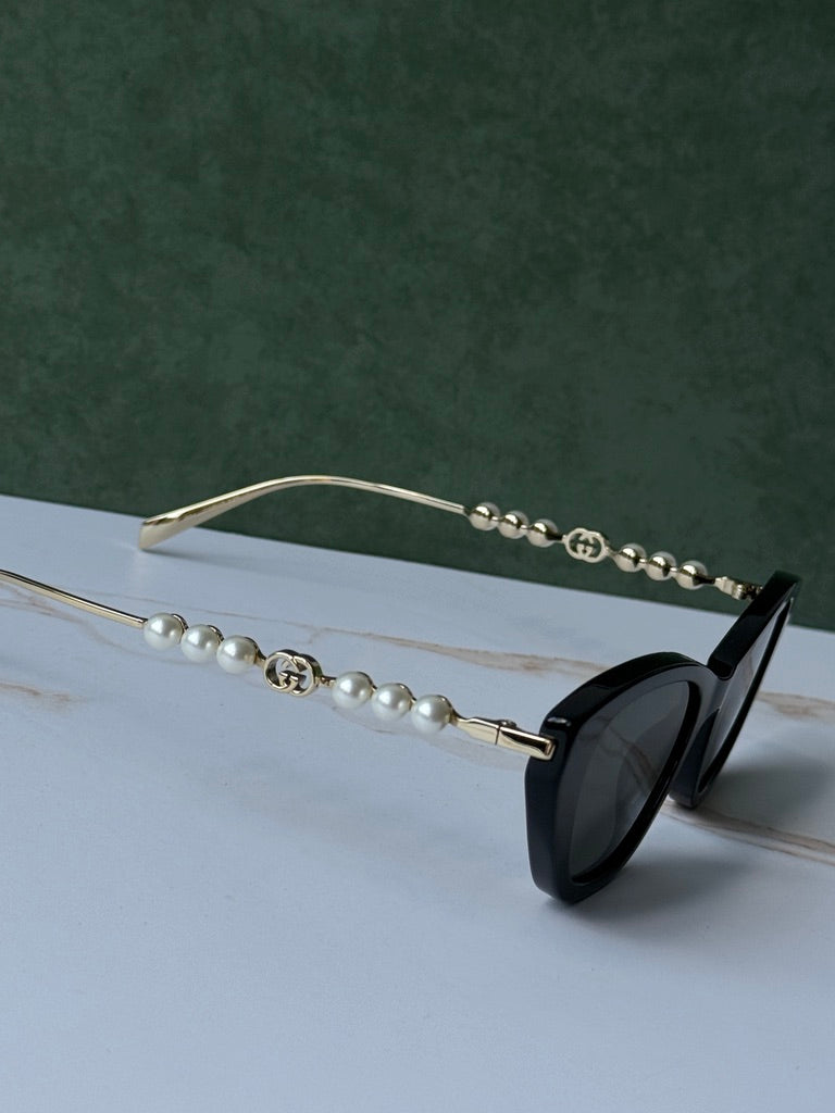 Gucci GG1257S Gafas de sol redondeadas con lentes marrones y rojos