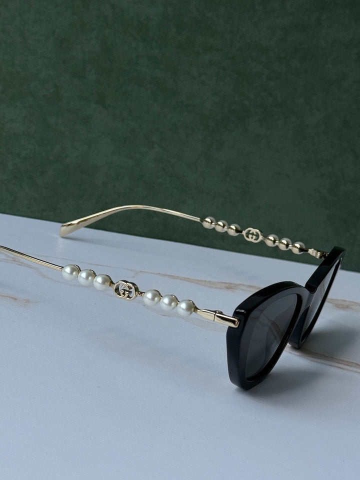 Gucci GG1257S Gafas de sol redondeadas con lentes marrones y rojos