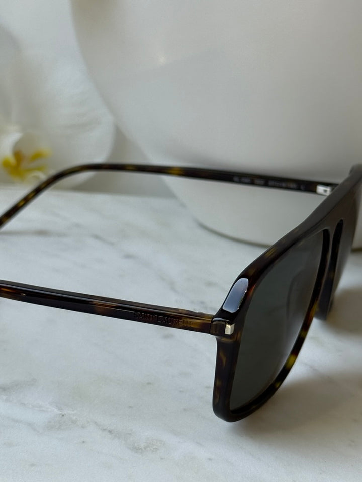 Aviator sunglasses side view: havana brown temple and dark lens