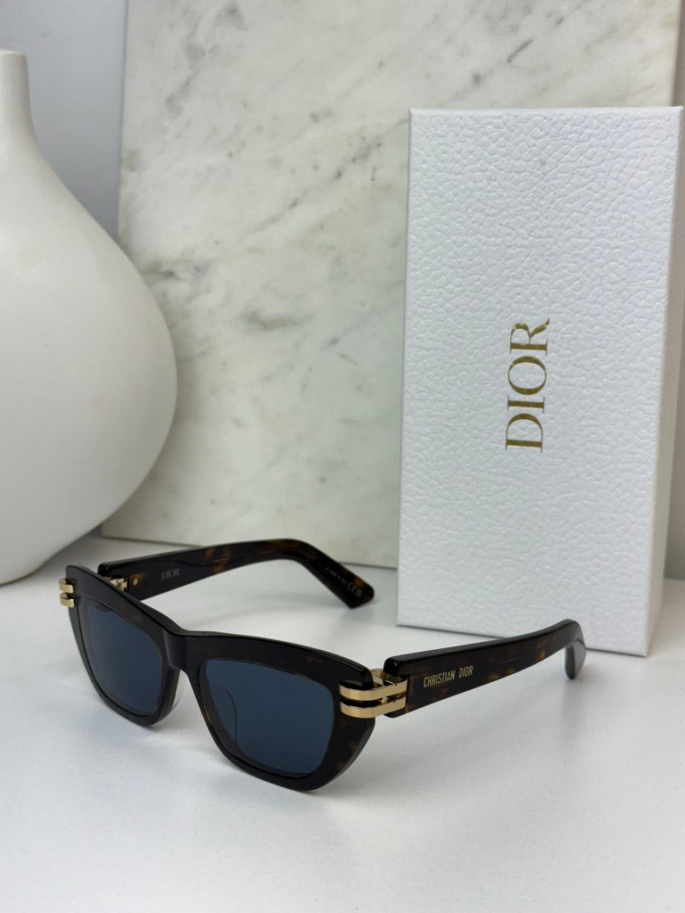 Havana brown Dior sunglasses with blue-tinted lenses and gold bridge detail