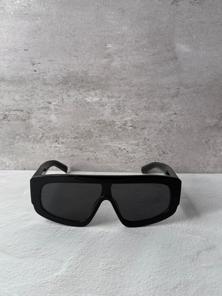 Black PRADA sunglasses with dark lenses and wide squared frame