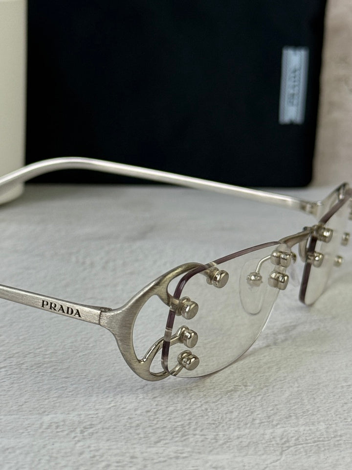 Prada PR C57S Rimless Sunglasses in Silver Bluelight