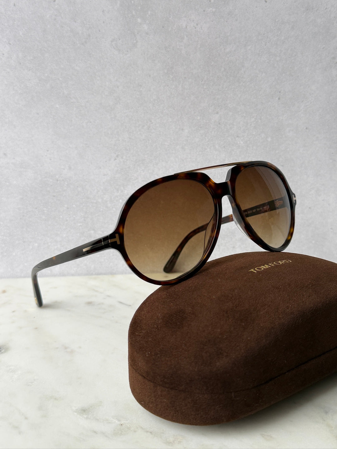 Aviator sunglasses, side view, havana-brown tortoise frame with brown tinted lenses