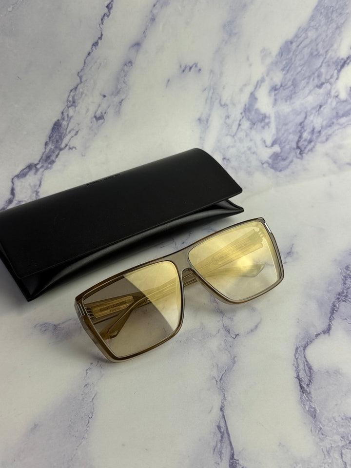 Beige flat-top sunglasses with gold-tone frame and light-tinted lenses