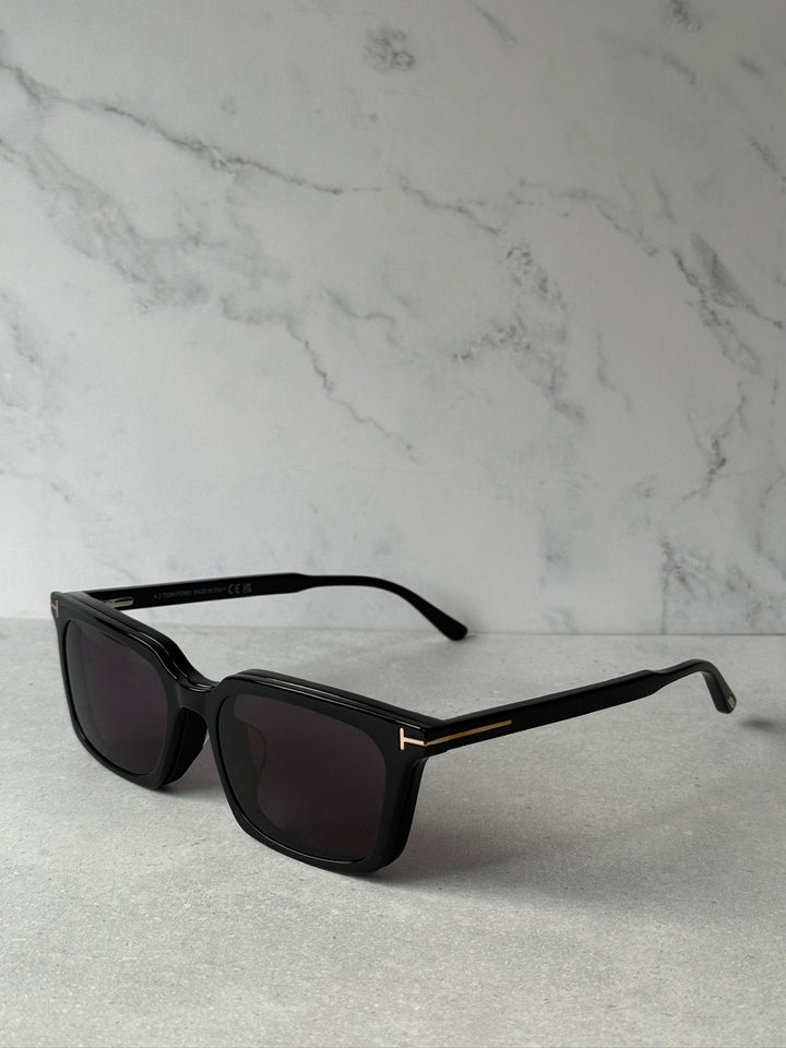 Black rectangular sunglasses side view with dark lenses and slim arms