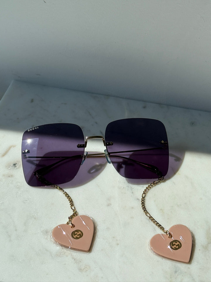 Gafas de sol cuadradas sin montura Gucci GG1147S con cadena verde 