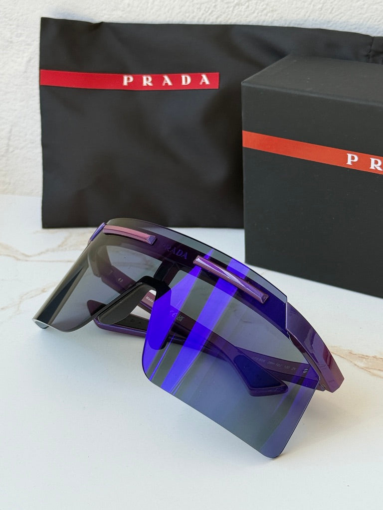 Purple Prada Sport PS sunglasses with mirrored shield lenses, side logo, and nose pads
