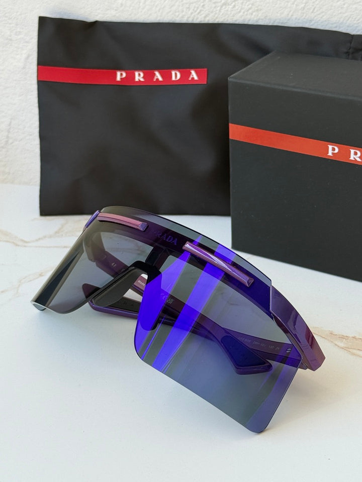Purple Prada Sport PS sunglasses with mirrored shield lenses, side logo, and nose pads