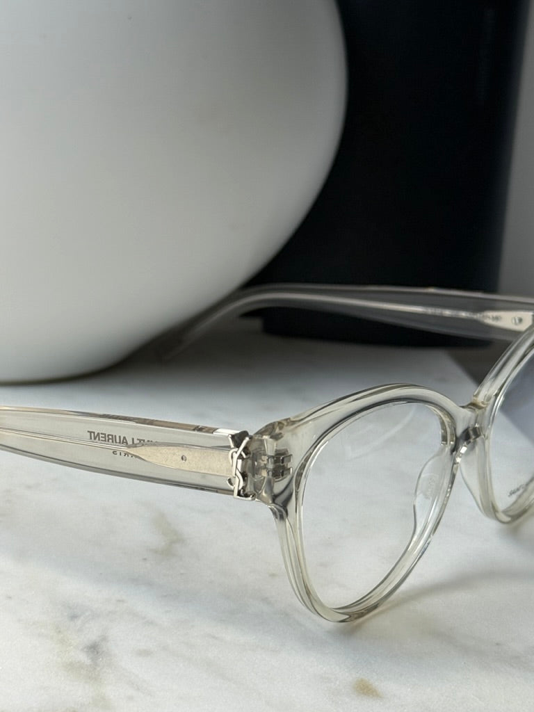 Saint Laurent clear eyeglass frames, close-up of temple with engraved text