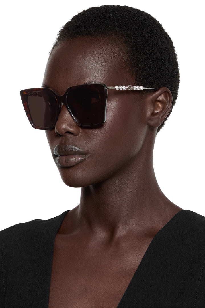 Gucci GG1257S Gafas de sol redondeadas con lentes marrones y rojos