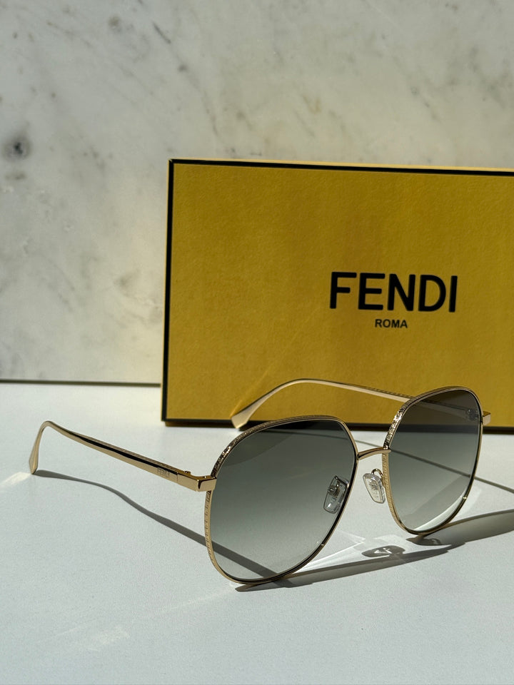 Fendi gold-tone metal round sunglasses with dark green lenses and angular temples