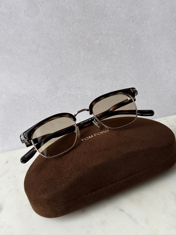 Dark Havana brown sunglasses with brown tinted lenses and gold accents, with soft case
