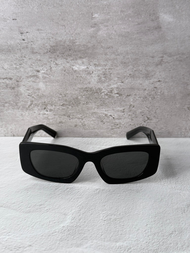 Black PRADA square sunglasses with dark lenses, front view
