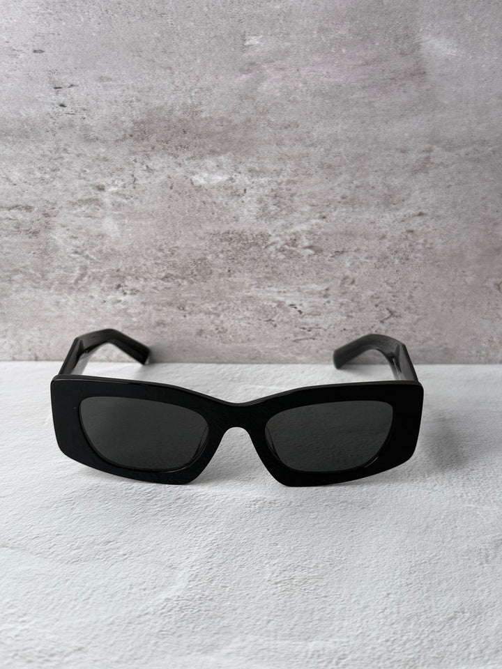 Black PRADA square sunglasses with dark lenses, front view