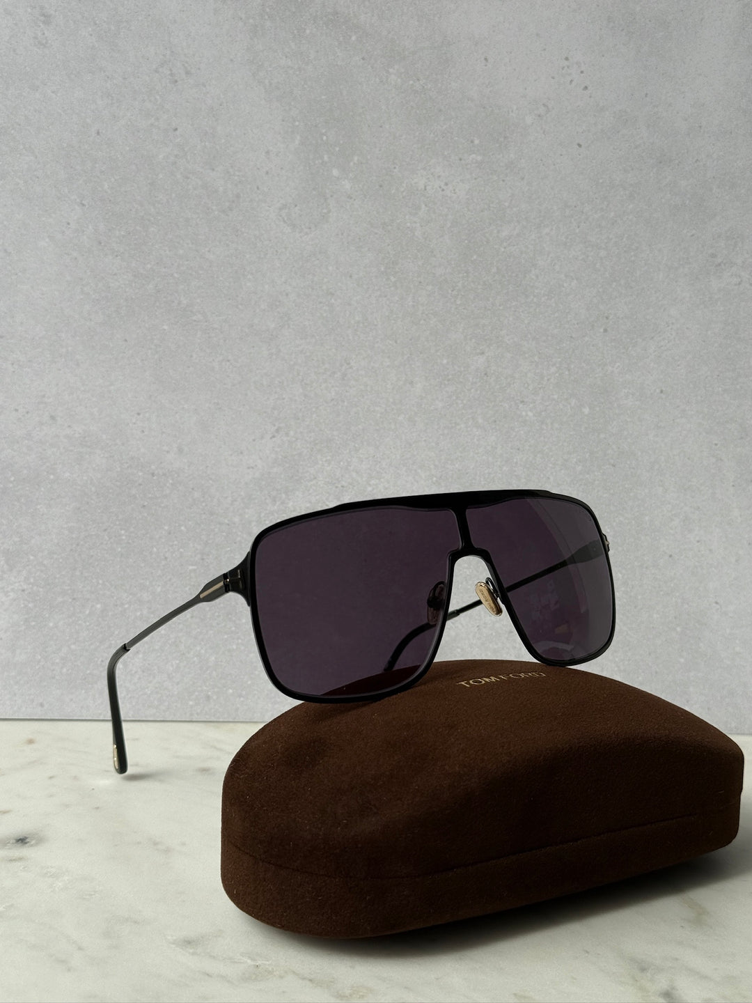 Zappa aviator sunglasses in black with purple-tinted lenses, with brown hard case