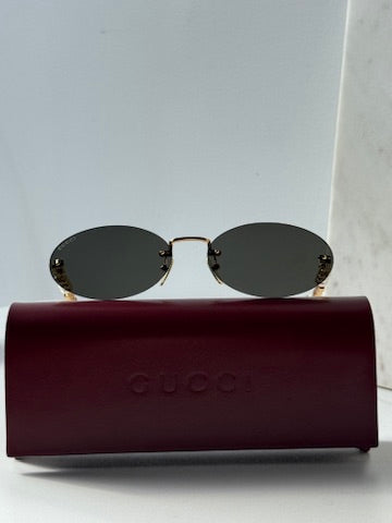 Gucci GG1257S Gafas de sol redondeadas con lentes marrones y rojos