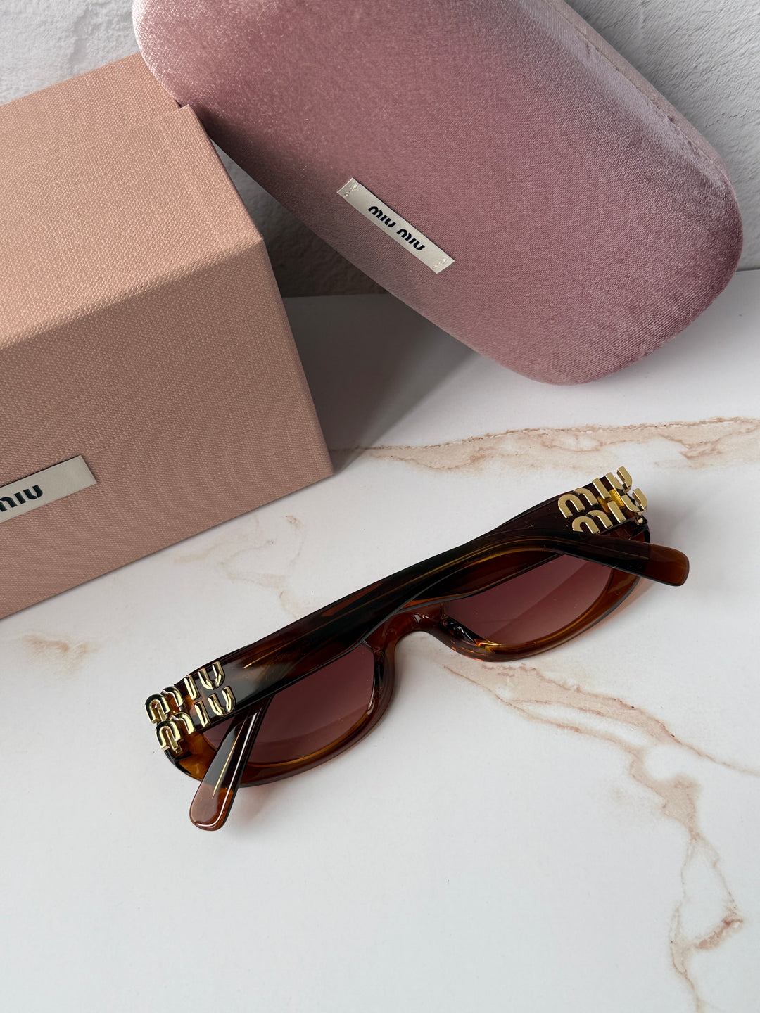 Miu Miu MU06ZS Tobacco Brown Red Oval Sunglasses