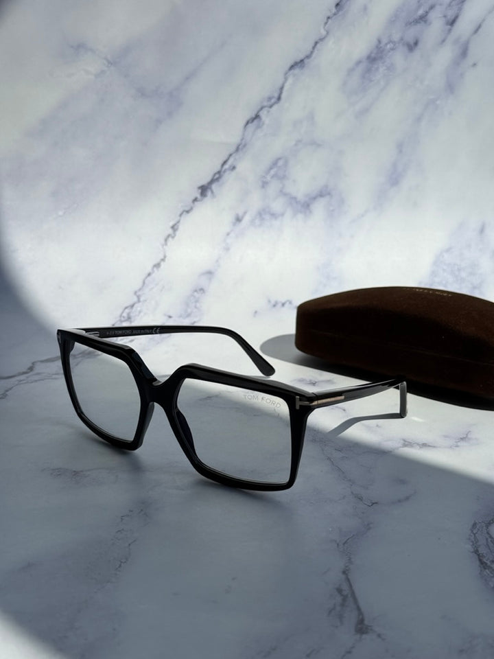 Tom Ford black clip-on sunglasses, side view with rectangular frame and temple arm