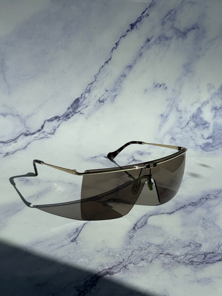 Gucci GG1096S Gafas de sol sin montura con protección marrón