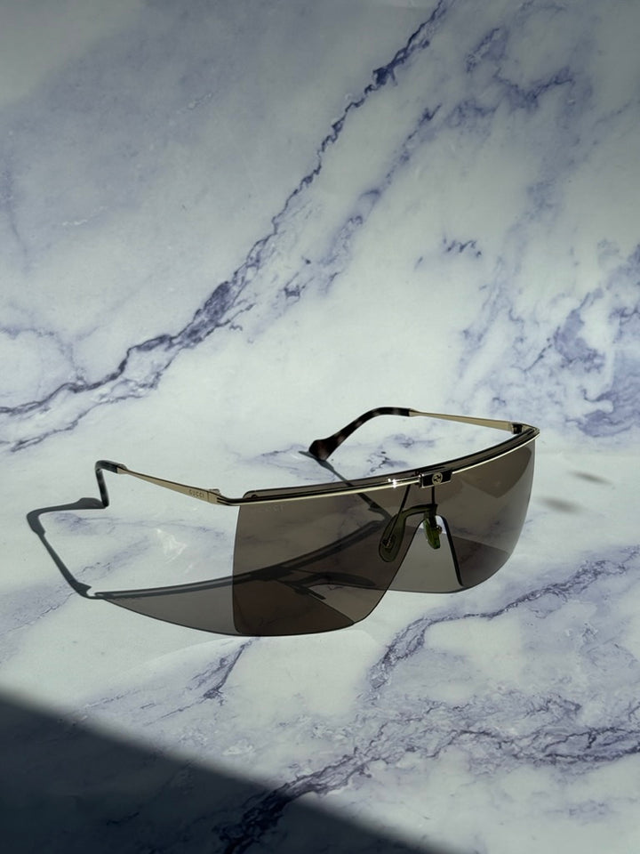 Gucci GG1096S Gafas de sol sin montura con protección marrón