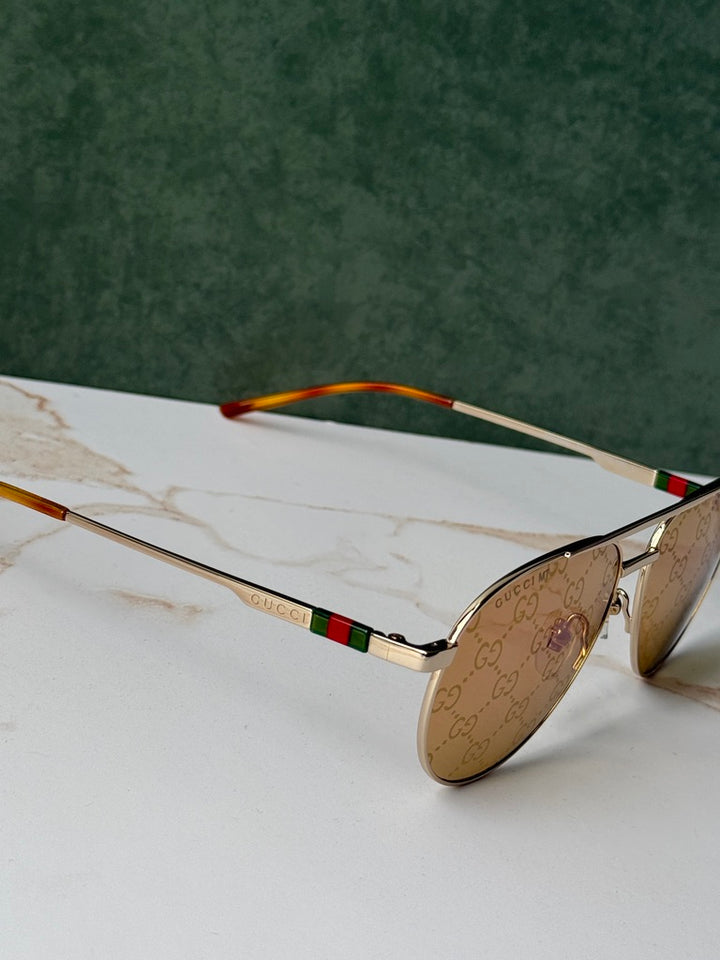 Gucci GG1220S Gafas de sol de aviador con monograma verde