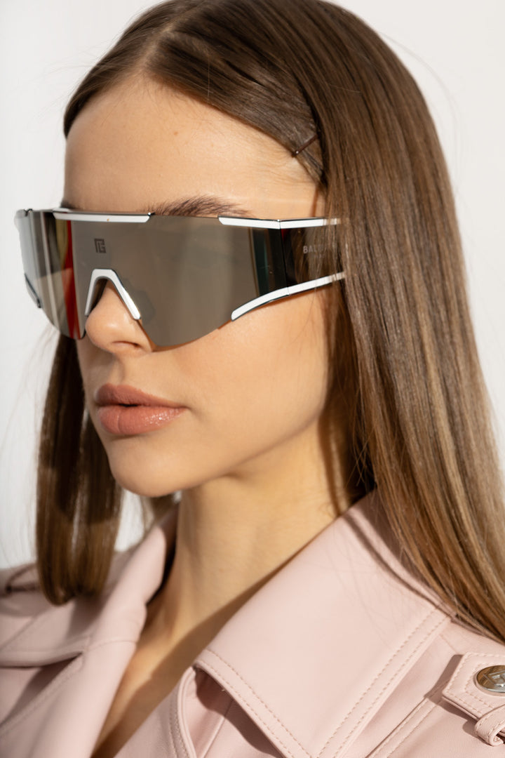 Balmain Fleche mask sunglasses on face, silver mirrored lenses and frame