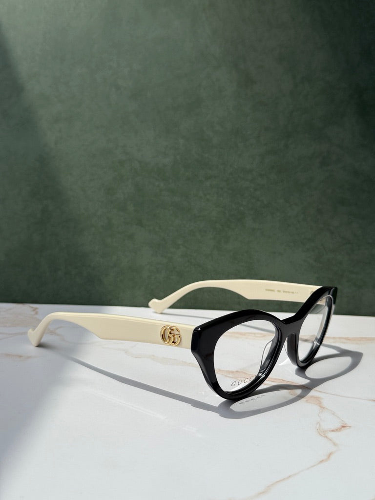 Monturas estilo ojo de gato Gucci GG0959O en negro marfil 