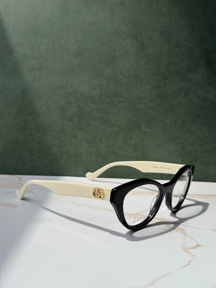 Monturas estilo ojo de gato Gucci GG0959O en negro marfil 