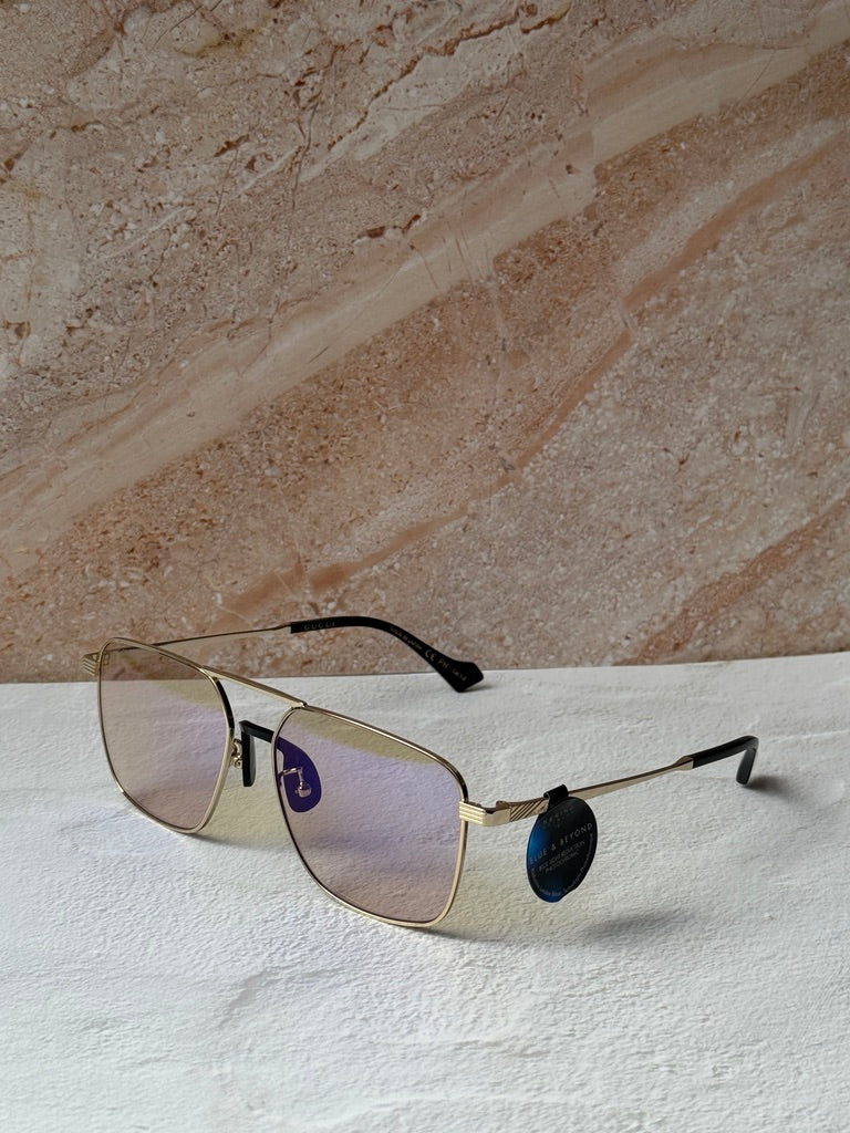 Gucci gold metal pilot sunglasses with photochromic lenses and black temple accents