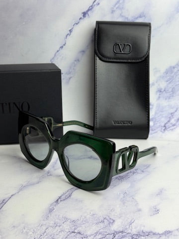 Green square sunglasses with dark lenses and V-shaped frame cutouts