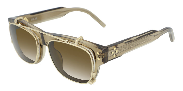 Transparent brown clip-on frames with dark brown lenses and gold-tone side arms