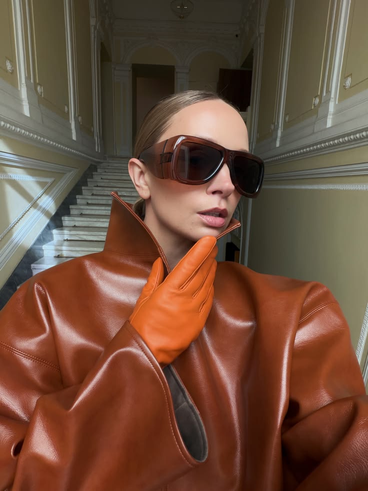 Brown sunglasses with dark tinted lenses, square frame