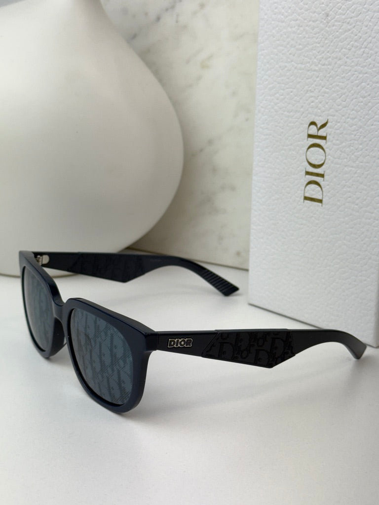 Navy Dior sunglasses with dark mirror lenses and logo temple, angled front view.