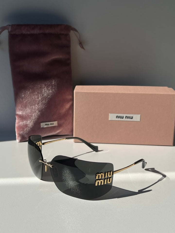 Gafas de sol Miu Miu MU54YS en gris oscuro