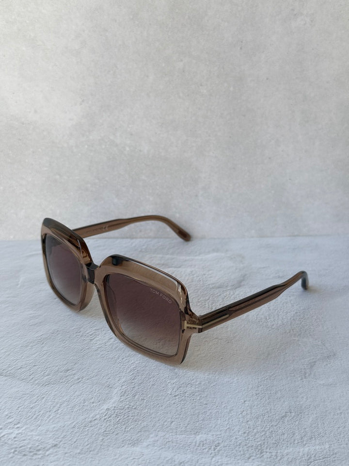 Rectangular sunglasses with translucent frame and tinted lenses, angled view