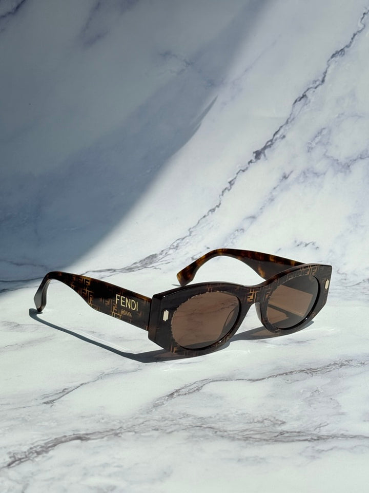 Tortoiseshell sunglasses with FENDI ROMA FF logo temple and dark round lenses