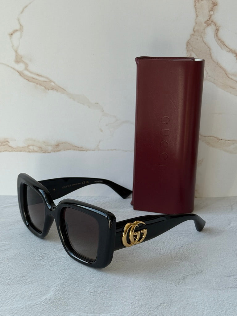 Gucci GG1975S cat-eye sunglasses, black frames with gold GG side emblem