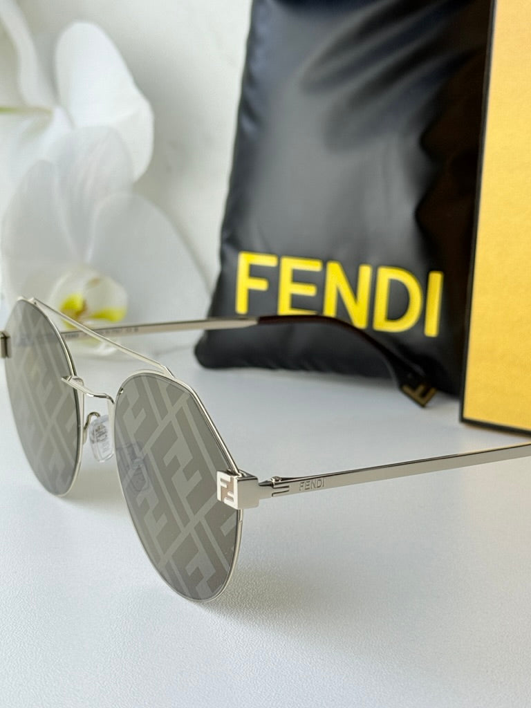 Round gold sunglasses with FF-pattern mirrored lenses, thin metal temple