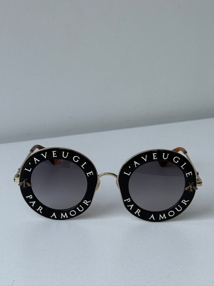 Gucci GG0113S Blind For Love Gafas de sol redondas negras