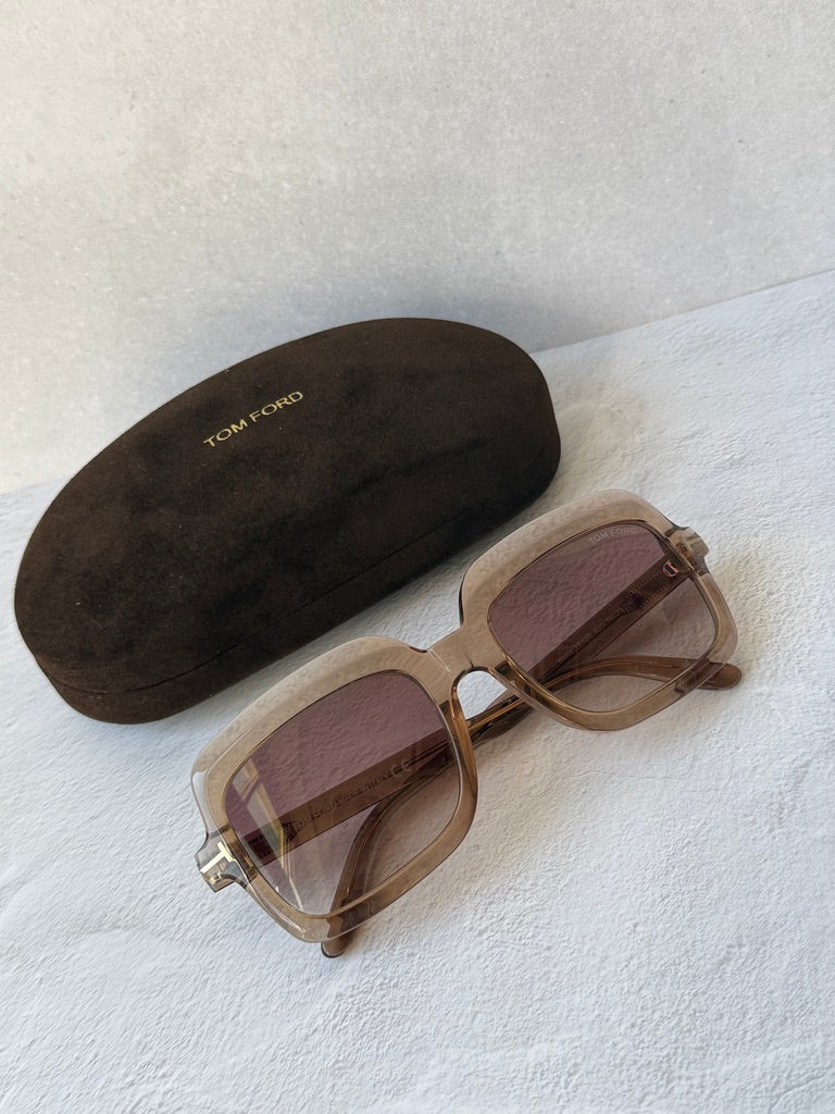 Transparent frame sunglasses with tinted lenses and gold-tone detailing, top view